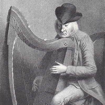Denis Hempson playing the harp